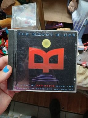 live performance album CD by The Moody Blues titled A Night at Red Rocks with th